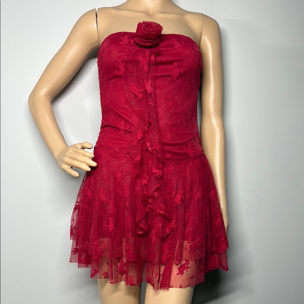 Red strapless lace mini dress with a rose detail.